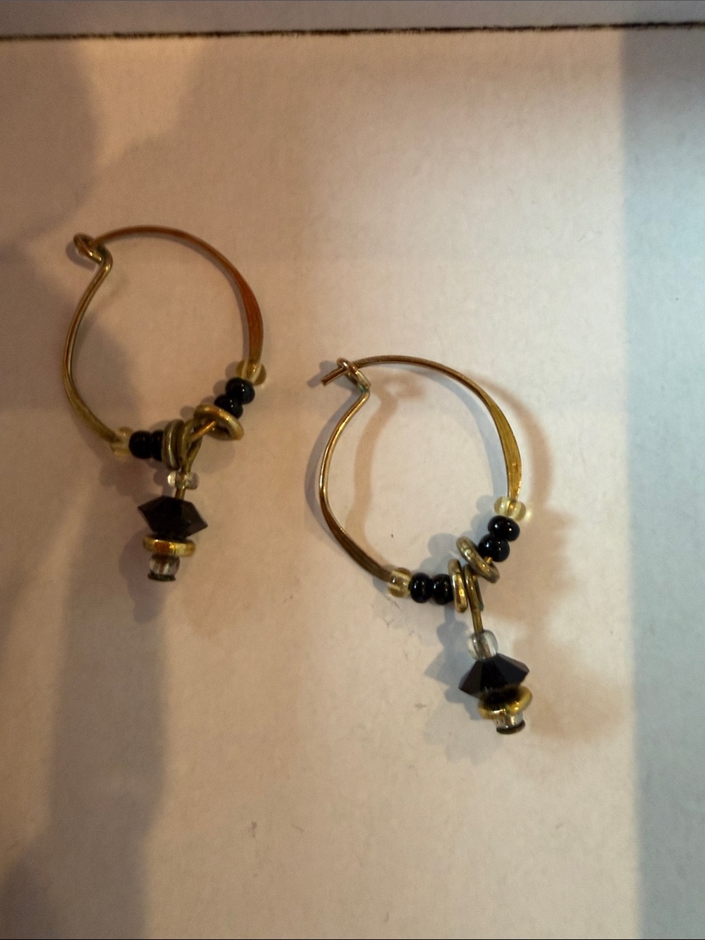 Gold Tone Hoop Earrings with Black Bead Drops